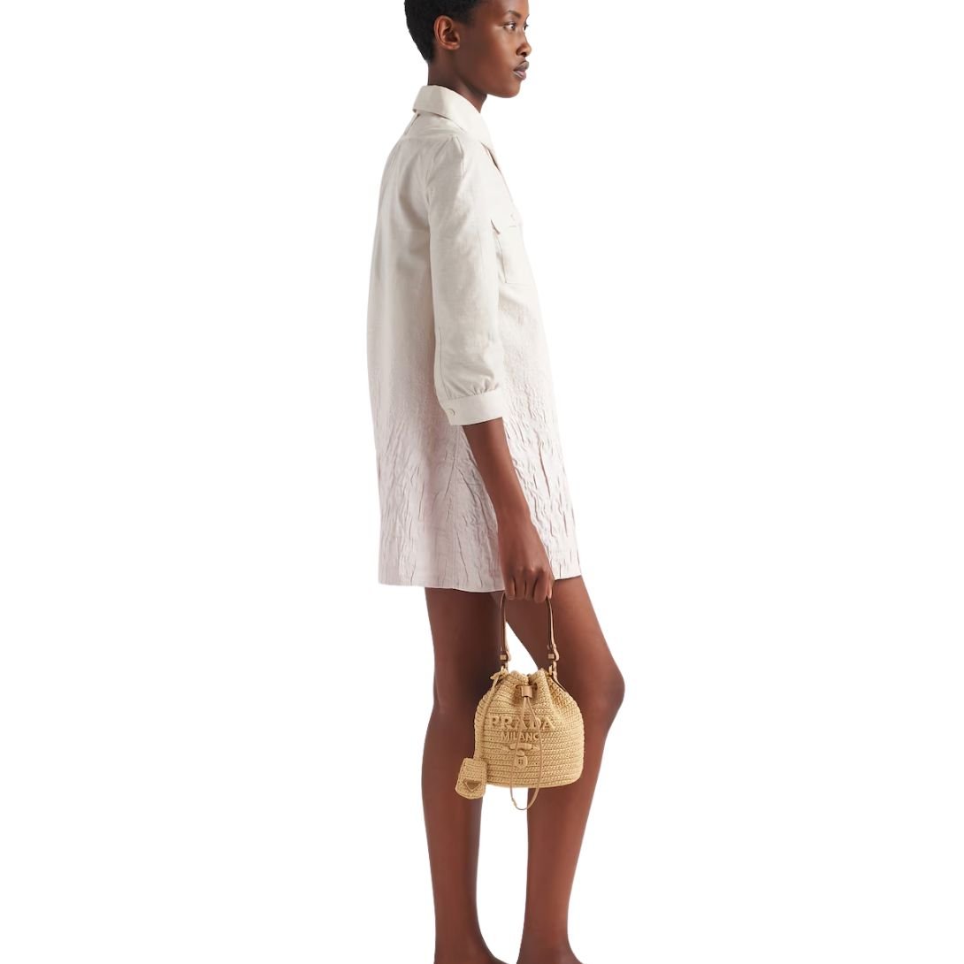 PRADA LOGO-EMBOSSED RAFFIA BUCKET BAG WOMEN NATURAL