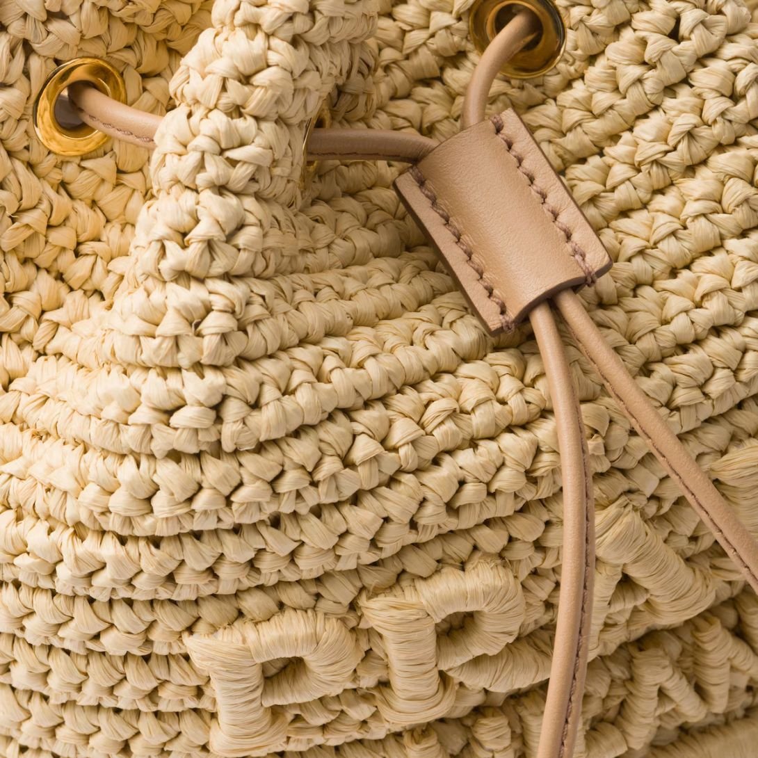 PRADA LOGO-EMBOSSED RAFFIA BUCKET BAG WOMEN NATURAL